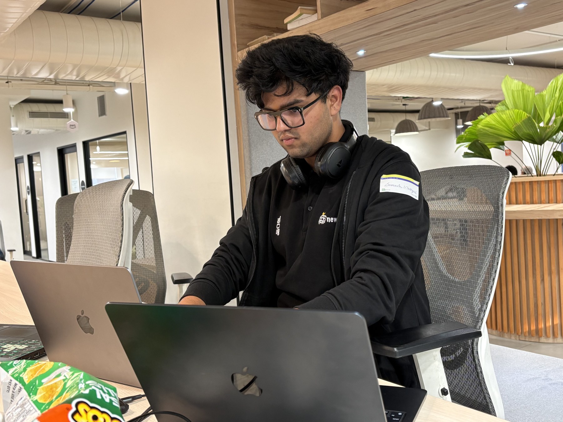 Somesh working on a laptop at a table
